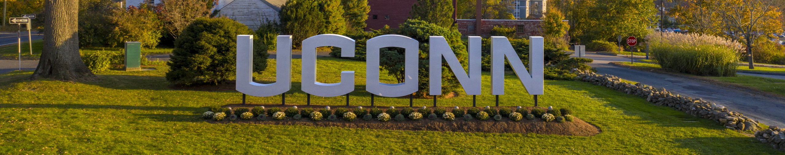 UConn sign at the north entrance to campus, autumn