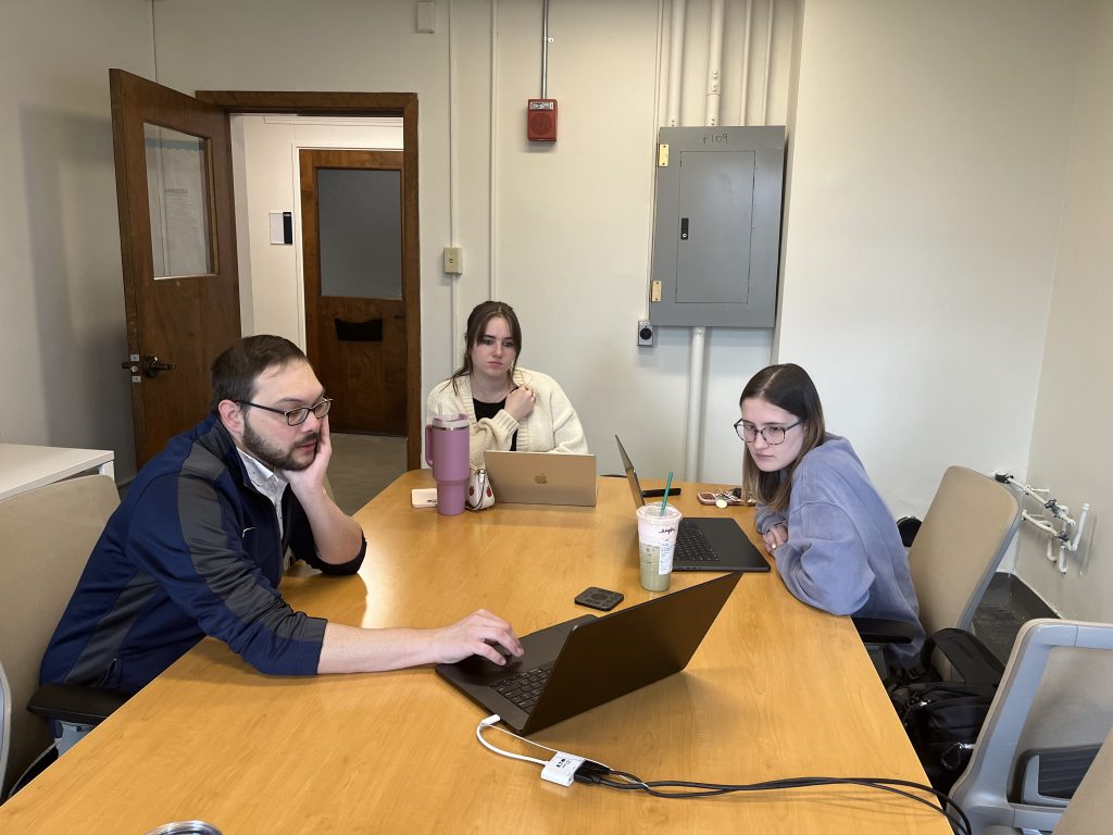 Members of the Health Communication Research Lab reviewing data